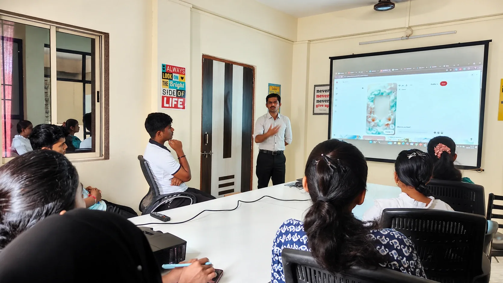 Trainer leading a session with students in the conference room