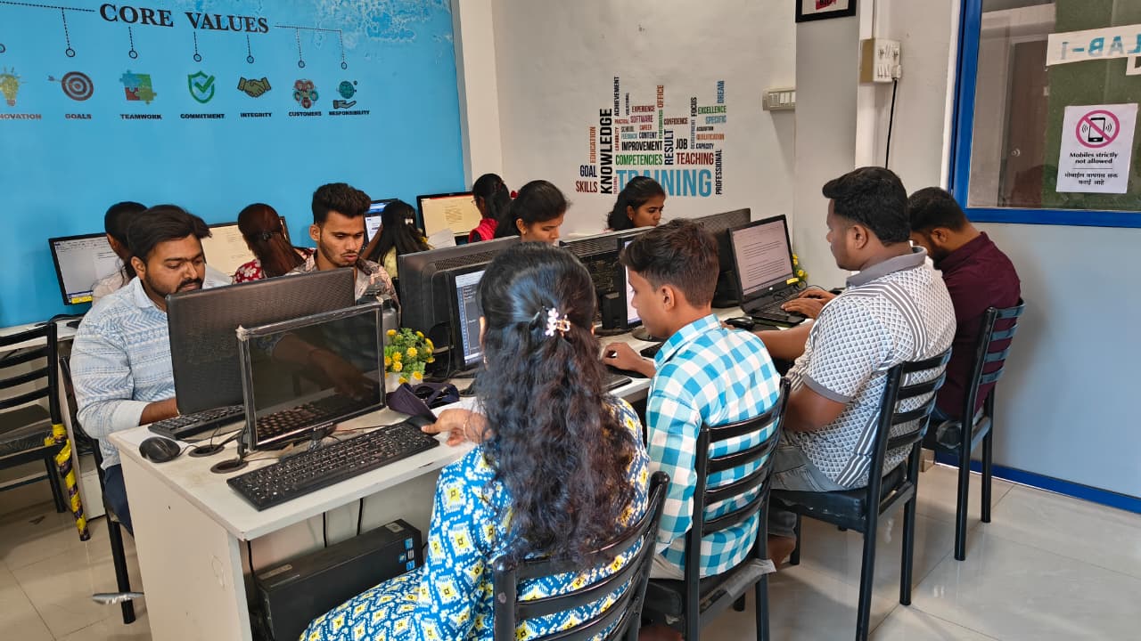 Students in the lab under the core values wall